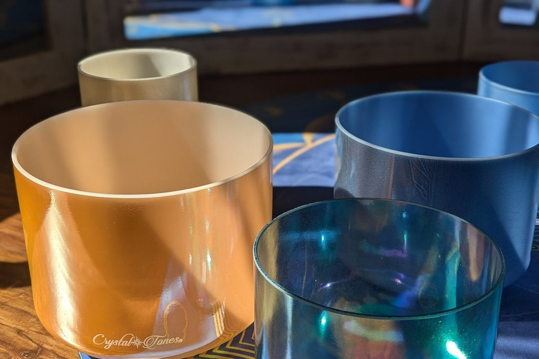 Crystal Tones alchemy singing bowls in gold, blue, and clear iridescent finishes