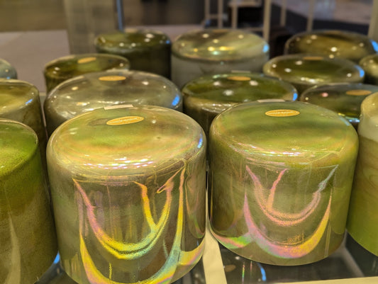 A close-up row of iridescent Crystal Tones quartz singing bowls on display