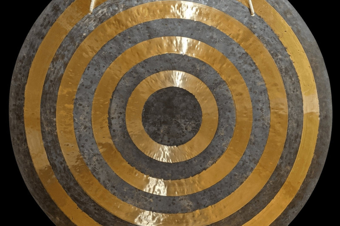 Sun gong with alternating lathed golden and raw bronze rings