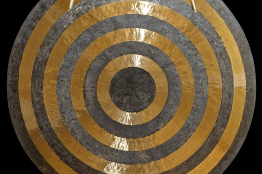 Sun gong with alternating lathed golden and raw bronze rings