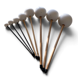 B Love Flumies friction mallets fanned out from small to large, carbon fibre and hardwood handles