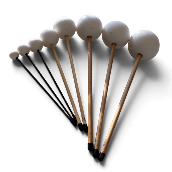 B Love Flumies friction mallets fanned out from small to large, carbon fibre and hardwood handles