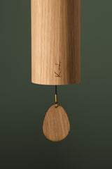 Close-up of the oak body and clapper on the Koshi Earth Symphony Forest chime