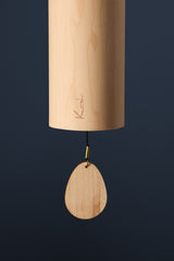 Close-up of the maple body and clapper on the Koshi Earth Symphony Ocean chime