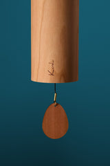 Close-up of the cherry body and clapper on the Koshi Earth Symphony River chime